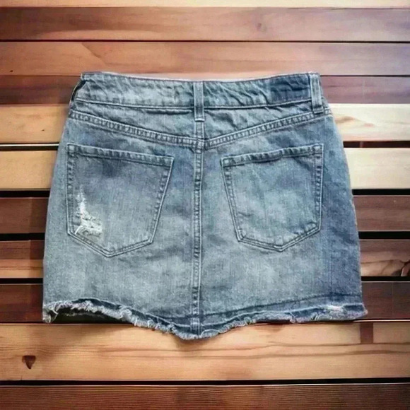 Rewash size 4, 25” waist ripped denim skirt with frayed bottom.  12.5” length - Picture 2 of 2